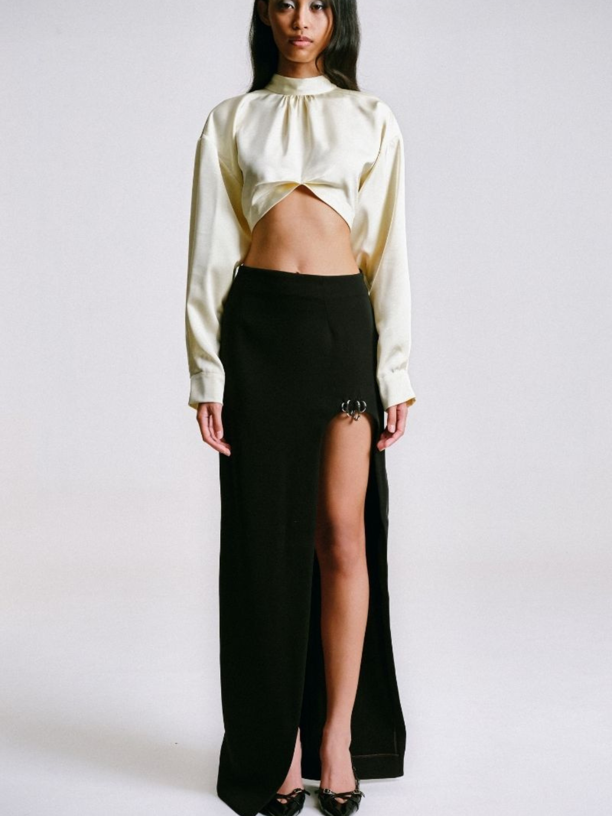 MAXI SKIRT WITH CUT-OUT SLIT AND PIERCING DETAIL