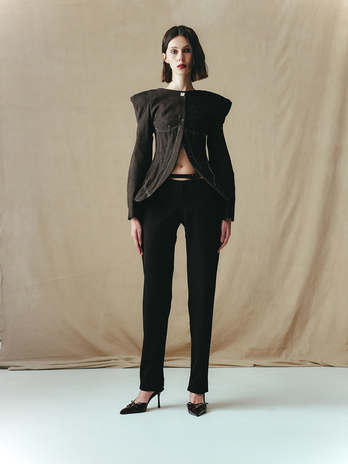 LOW-RISE TROUSERS WITH BUCKLES