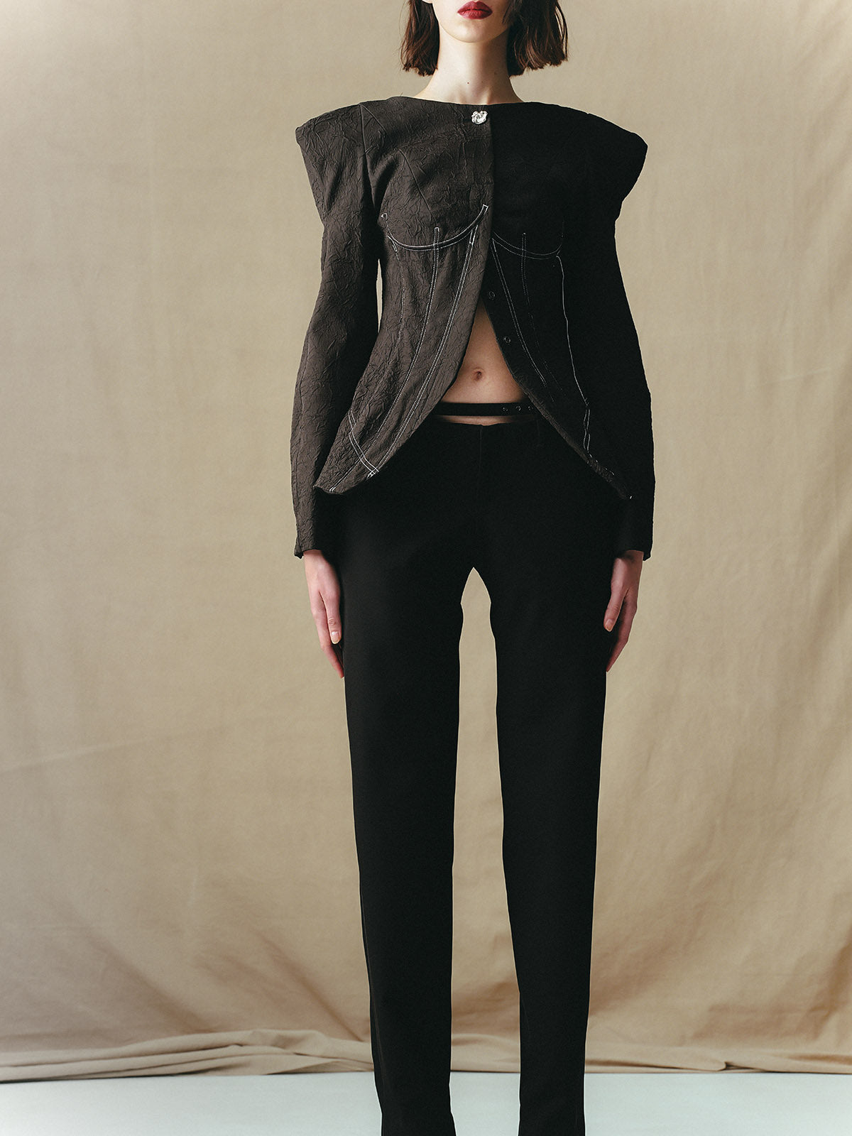LOW-RISE TROUSERS WITH BUCKLES