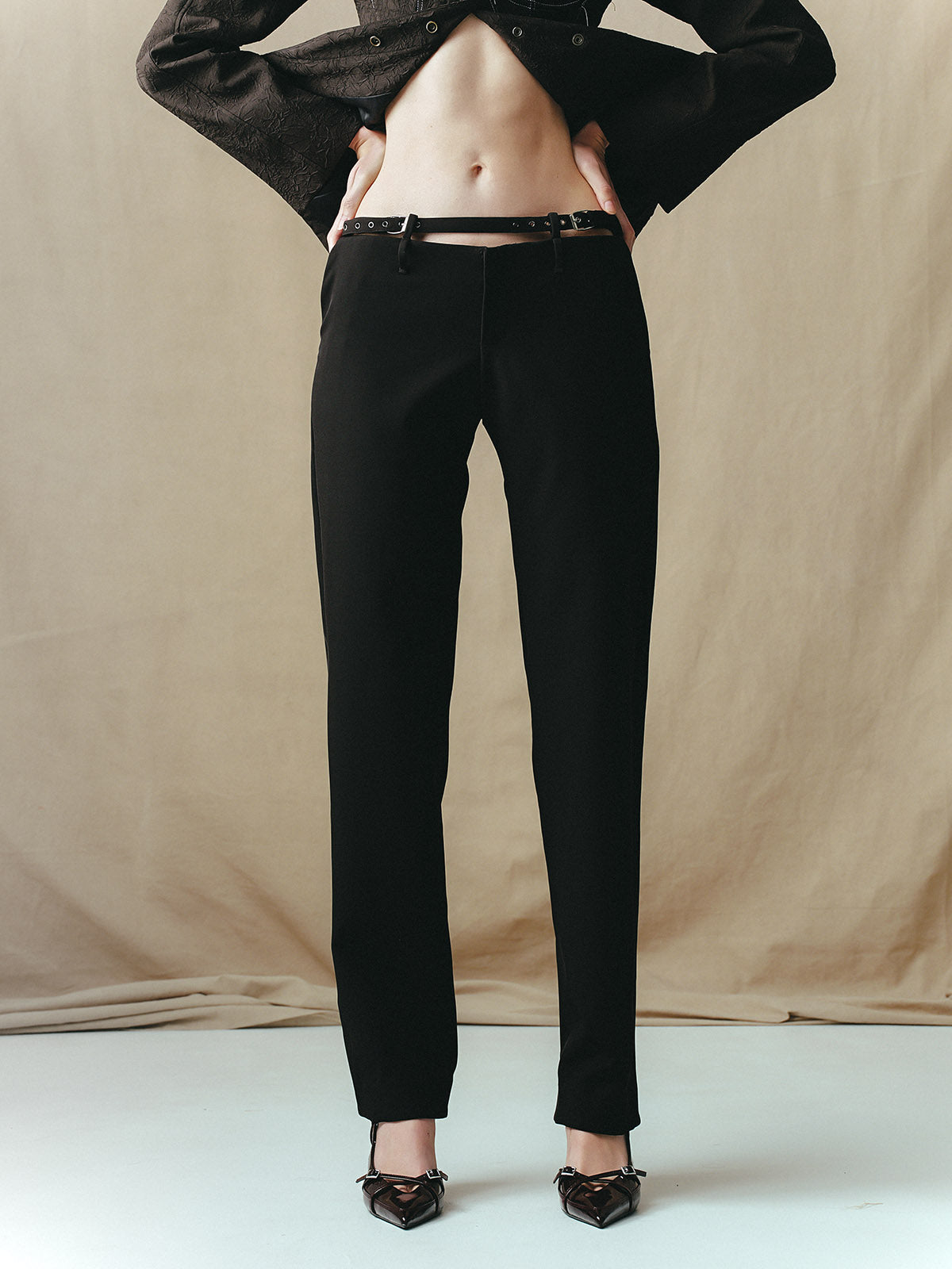 LOW-RISE TROUSERS WITH BUCKLES