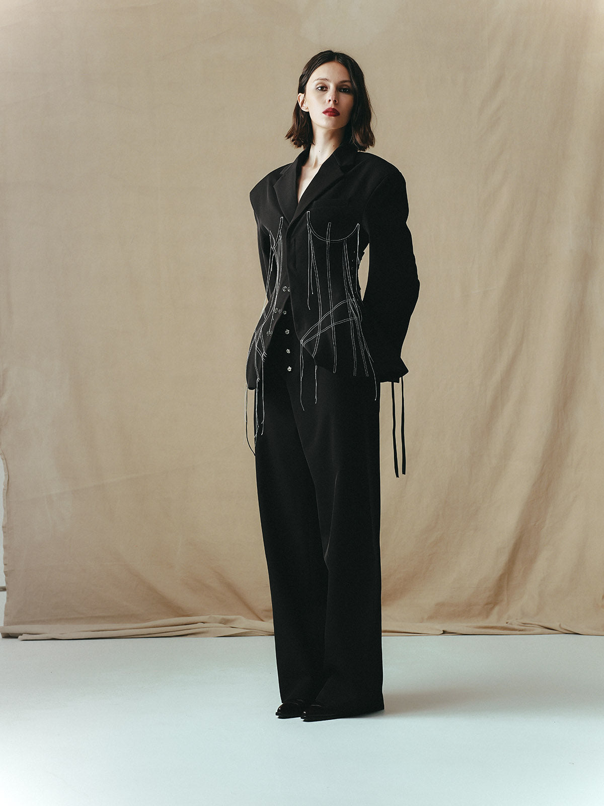 TAILORED SUIT WITH INSERTED CORSET PANELS