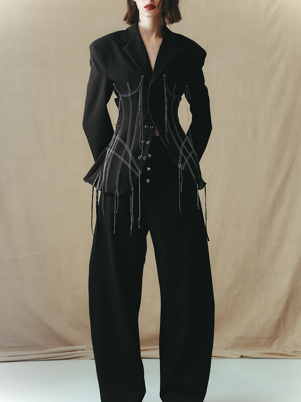 TAILORED SUIT WITH INSERTED CORSET PANELS